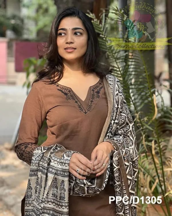 Khadi cotton kurti with intricate embroidery work on neck ,sleeves and hem paired with Khadi pants with embroidery work