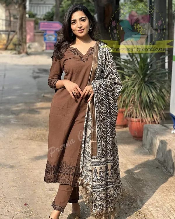 Khadi cotton kurti with intricate embroidery work on neck ,sleeves and hem paired with Khadi pants with embroidery work
