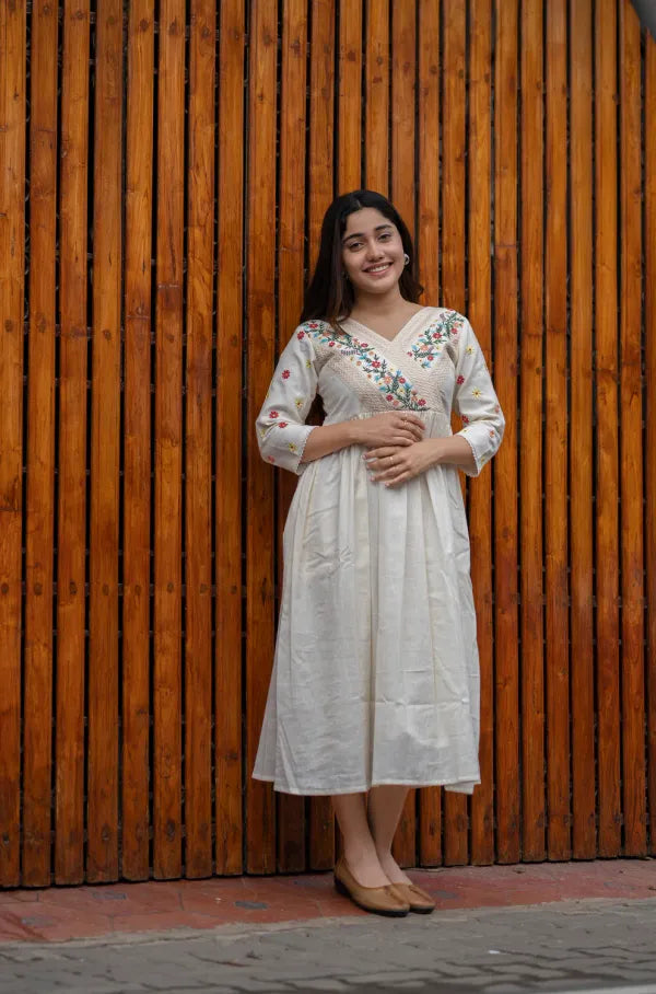 Off white cotton dress with floral embroidery and crochet lace detailings