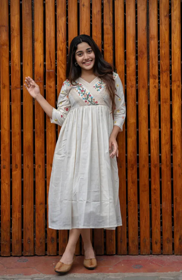 Off white cotton dress with floral embroidery and crochet lace detailings