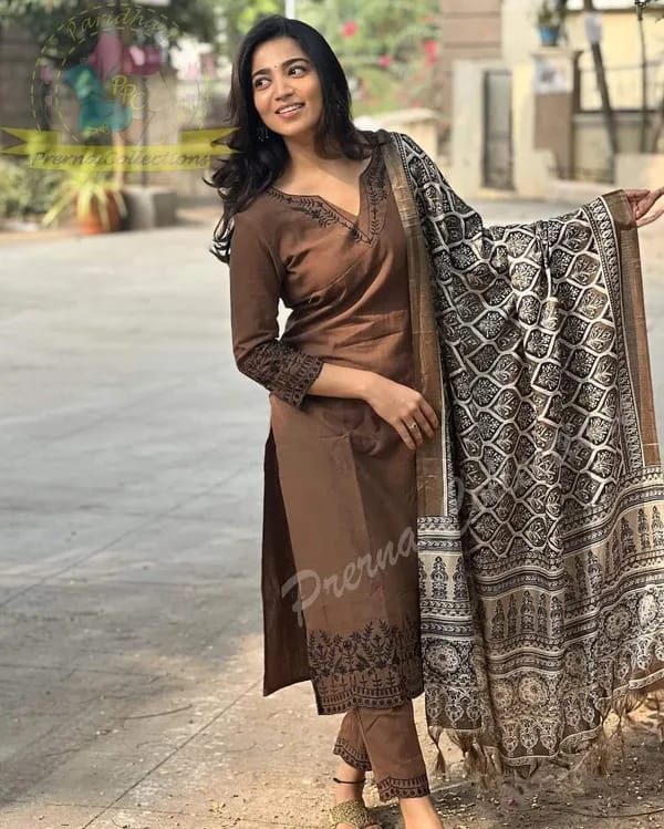 Khadi cotton kurti with intricate embroidery work on neck ,sleeves and hem paired with Khadi pants with embroidery work